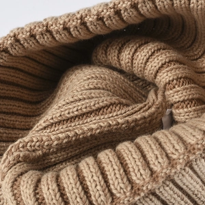 Close-up detail of warm brown ribbed knit winter beanie hat texture