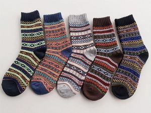 Close-up of five pairs of vintage ethnic style wool blend socks with knit patterns
