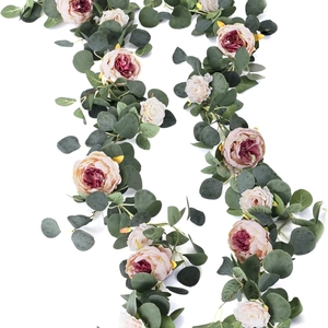 Artificial eucalyptus and pink peony floral garland for wedding wall decor on white background