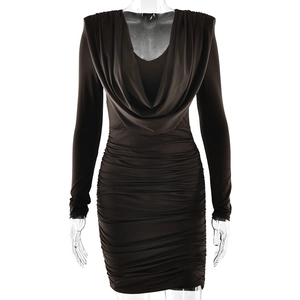 Detail view of black cowl neck dress featuring slim fit long sleeves and ruched texture