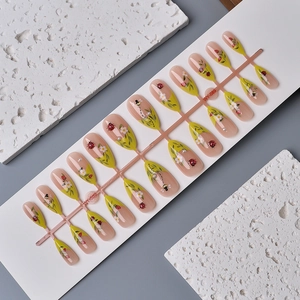 Almond press-on nails with 3D insect designs and floral art on 24-piece pink sprue