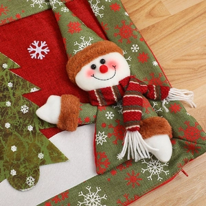 Christmas snowman pillow cover with red and green embroidery and linen texture detail