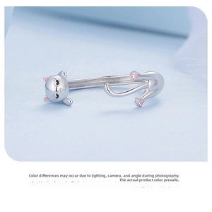 Detailed close-up of S925 sterling silver black cat open ring with pink enamel paw details