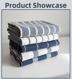 Detailed view of blue and white striped cotton waffle napkins in a five-piece stacked set