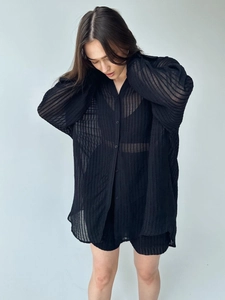 Women's black sheer vertical striped shirt and shorts set with a loose fit texture