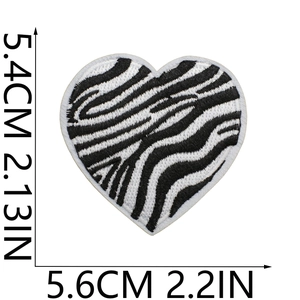 Detailed size specifications for zebra-striped heart embroidered patch in black and white