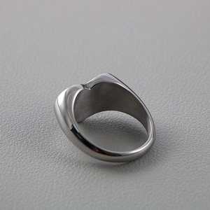 Detailed close-up of thick silver titanium steel ring with smooth brushed metal finish