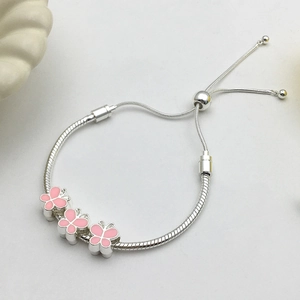 Silver snake chain bracelet with pink enamel butterflies and adjustable slider clasp