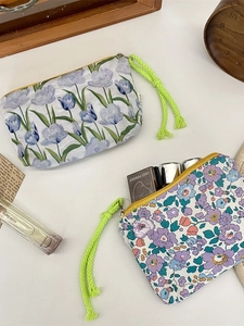 Set of minimalist floral cosmetic storage bags with neon green braided rope handles