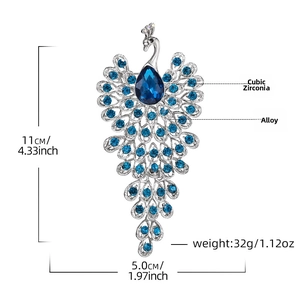 Peacock brooch detail with blue crystals and silver alloy measuring 11cm by 5.0cm