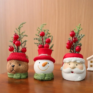 Detailed view of resin Christmas ornaments featuring a bear, snowman, and Santa Claus