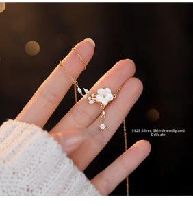 Detailed close-up of S925 sterling silver flower pendant with shimmering cubic zirconia