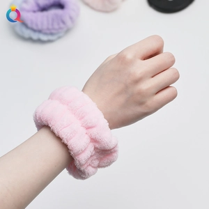 Detail of pink coral fleece wristbands for washing face to prevent water spilling