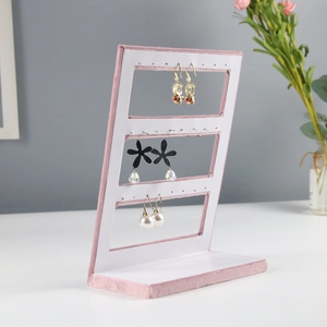 Three-tier pink velvet jewelry display stand for earrings with a stable base design