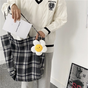 Casual large plaid wool shoulder bag featuring a cute white flower charm detail