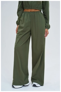 Detail of army green sun-protective set featuring elastic high-waisted wide-leg pants