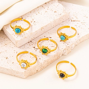 Adjustable 304 stainless steel rings with colorful floral stones on travertine stone