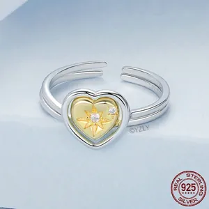 Adjustable S925 sterling silver heart ring with gold starburst and white zircon stone