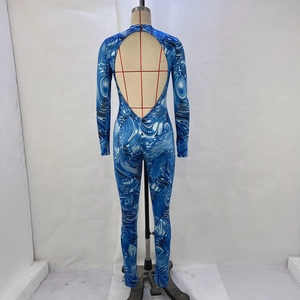 Detail of blue and white swirl print long sleeve jumpsuit with deep V-back cutout design