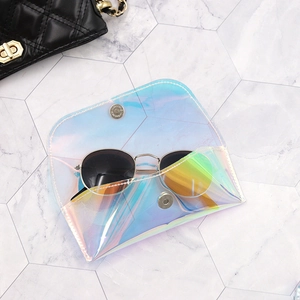 Holographic PVC sunglasses pouch with magnetic snap closure on marble background