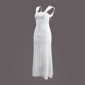 Detail shot of the vertical pleated texture on this white backless maxi summer dress