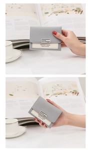 Close-up of minimalist mini square buckle coin purse with grey and white leather stitching