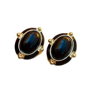 Vintage gold metal earrings with black oval enamel and small bead accents in pairs