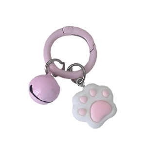Cute pink cat paw keychain with a metal bell and round lobster clasp on white background