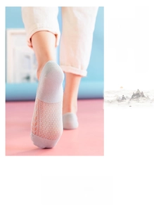 Close-up of light gray mesh ankle socks featuring breathable cotton fabric for summer