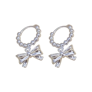 Silver bow dangle hoop earrings featuring a minimalist metallic geometric design for women