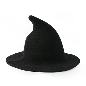 Knitted black witch hat with a pointed top and wide brim for Halloween cosplay