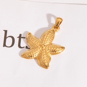 Detailed view of a gold starfish pendant with granular texture and integrated bail