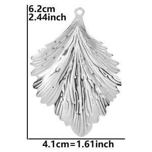 Detailed view of leaf pendant with textured veins and size markers in inches and cm