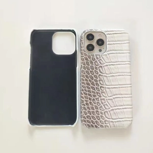 Macro shot showing gradient crocodile texture leather and interior of iPhone case