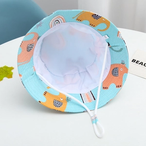 Detail of baby sun hat with blue elephant print, sweat-wicking lining and windproof strap