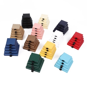 Multi-colored drawer jewelry boxes in various sizes with pull handles for storage