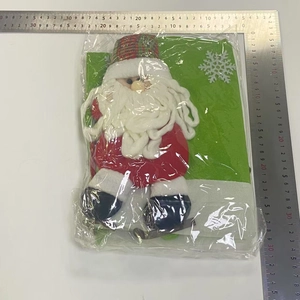 Detail of Santa chair cover featuring plush beard and festive plaid trim decoration
