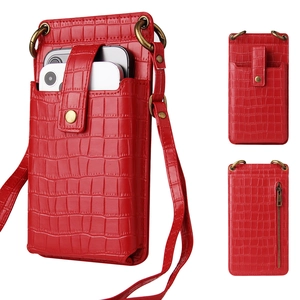 Detail view of red crocodile pattern phone bag with snap pocket and back zipper pocket