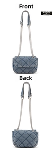 Front and back views of a light blue quilted denim chain shoulder bag with metal strap