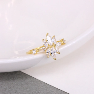 Macro shot of gold floral ring with marquise-cut marquise cubic zirconia stones