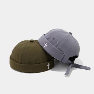 Front and back view of olive and grey docker caps with cross embroidery and metal buckle
