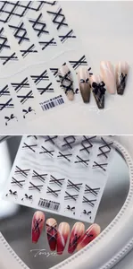 Detailed view of retro British plaid and bow nail art stickers with matte finish effects