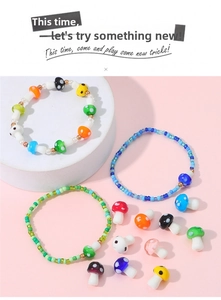 Detailed view of assorted colorful mushroom glass beads for DIY jewelry making and crafts