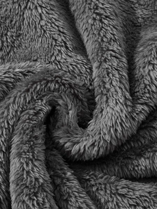 Macro shot of dark grey double-sided fleece jacket texture with soft plush fabric details
