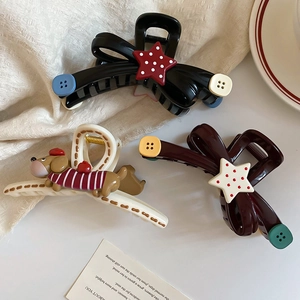 Three-piece acrylic hair claw clips featuring star buttons and dachshund dog designs