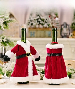 Detail of velvet Santa jacket and dress wine bottle covers for festive table decor