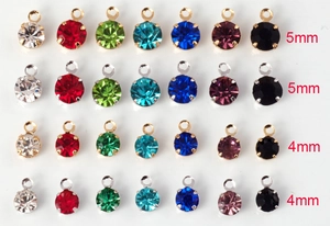 Macro view of assorted zircon pendants in 4mm and 5mm sizes with colorful gemstones