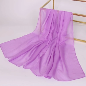 Close-up of lightweight purple chiffon scarf showing soft texture on a metal stand