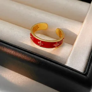 18k gold plated open ring with red enamel flower and zircon star decoration