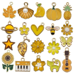 Set of 20 yellow enamel flower and leaf charms for DIY bracelets and necklaces